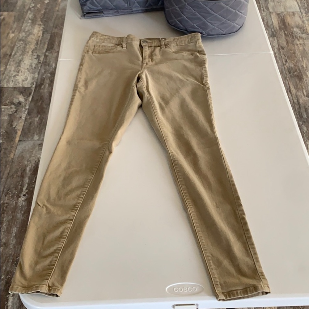 Khaki colored mid-rise jeans